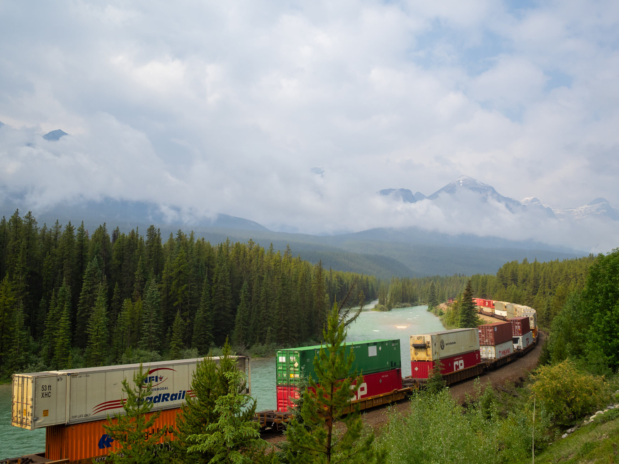 A freight train passing Morant's Curve, Banff NP, Canada